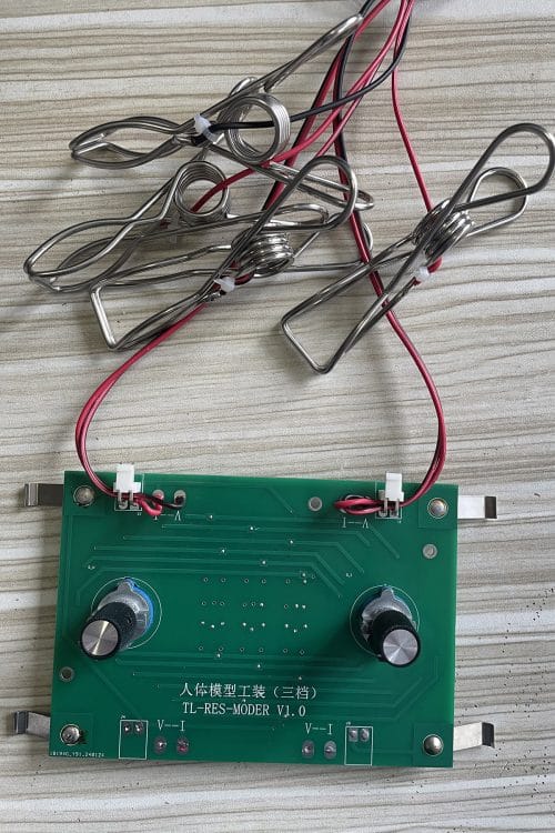 The iBodyinfo RES-MODER, a 3-gear BIA calibration fixture, shown with its high-precision adjustment knobs and electrode connection wires.