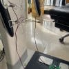 A full system calibration setup, with the iBodyinfo RES-MODER BIA validation tool connected to both hand and foot electrodes of an analyzer.