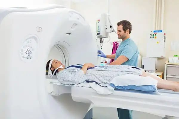 In a hospital, a technician prepares a patient for a Magnetic Resonance Imaging (MRI) scan for precise body composition analysis.