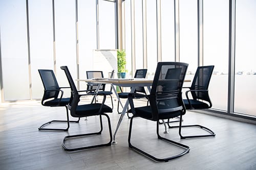 A bright, modern meeting room providing a professional environment for team strategy sessions and client meetings.