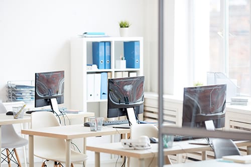 An office focused on scientific research, with computers displaying complex biodata analysis, reflecting the company's deep technical and research background.